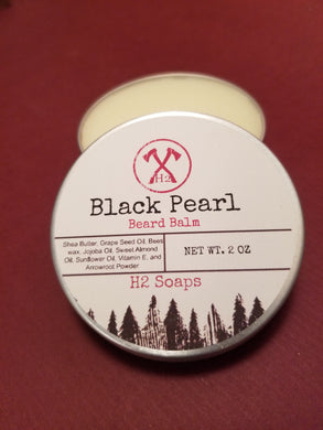 Handcrafted beard balm in Black Pearl scent.  Style while softening and moisturizing your beard.  Improves beard health and last all day while smelling good.  Acts as both a leave-in-beard conditioner and a shaping/styling aid.  A little goes a long way.  Ingredients:  Shea Butter, Grapeseed Oil, Bees Wax, Jojoba Oil, Sweet Almond Oil, Sunflower Oil, Vitamin E, and Arrowroot Powder. **Not edible.  Do not consume.  For external use only.  Keep out of eyes and mouth.  Discontinue use if irritation occurs. 