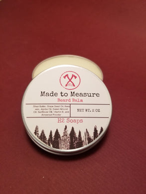 Handcrafted beard balm in Made to Measure scent. Style while softening and moisturizing your beard.  Improves beard health and last all day while smelling good  Ingredients:  Shea Butter, Grapeseed Oil, Bees Wax, Jojoba Oil, Sweet Almond Oil, Sunflower Oil, Vitamin E, and Arrowroot Powder. **Not edible.  Do not consume.  For external use only.  Keep out of eyes and mouth.  Discontinue use if irritation occurs.